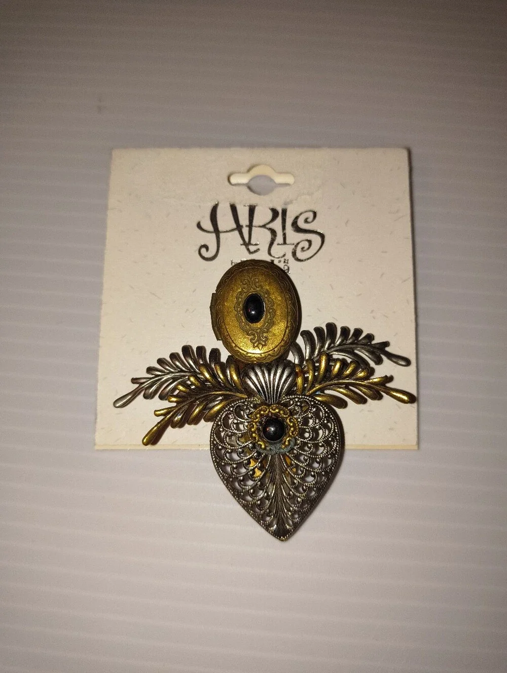 Aris Two-Tone Filigree Heart Brooch with Black Cabochons